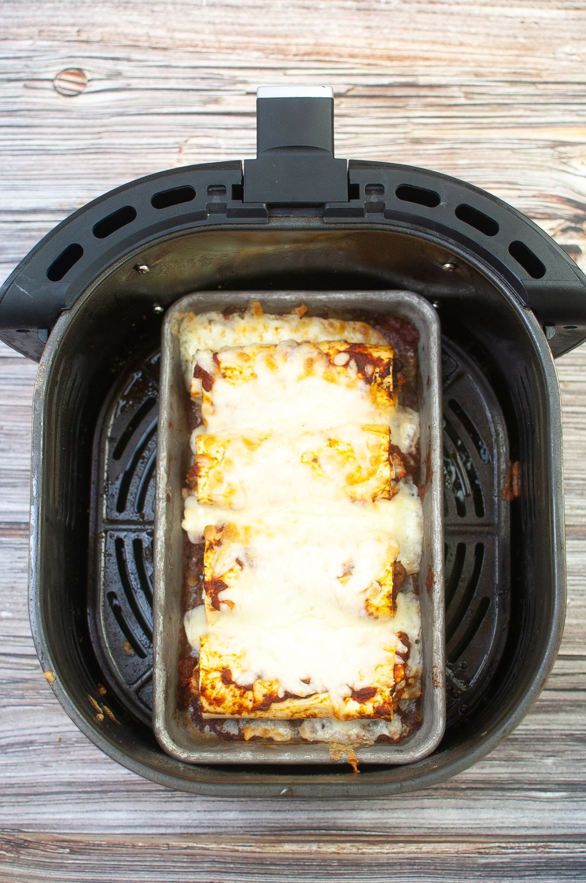 lasagna roll in a Baking pan that's in the Air Fryer.