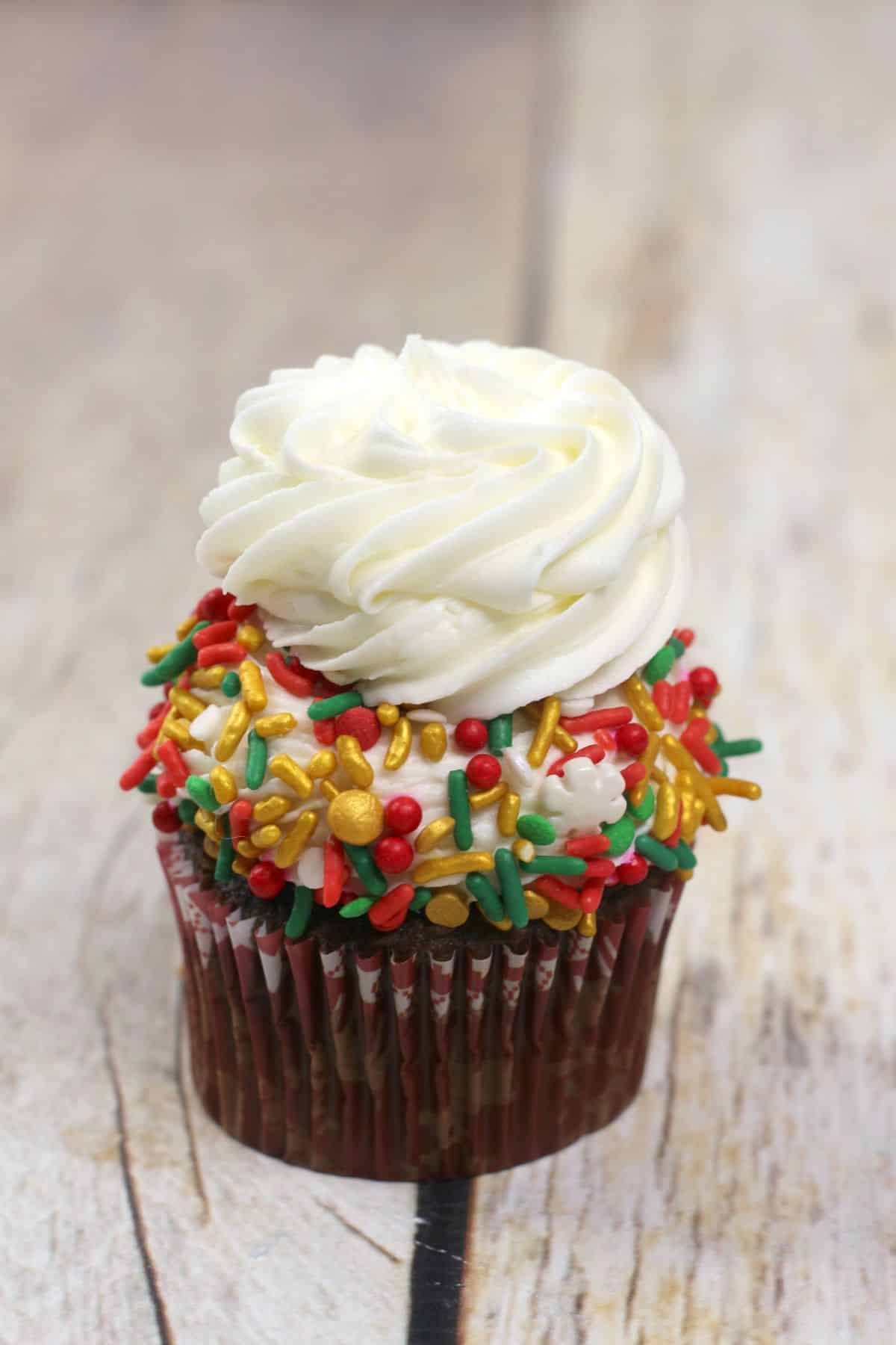 Another frosting is added on the top of the cupcake with sprinkles.