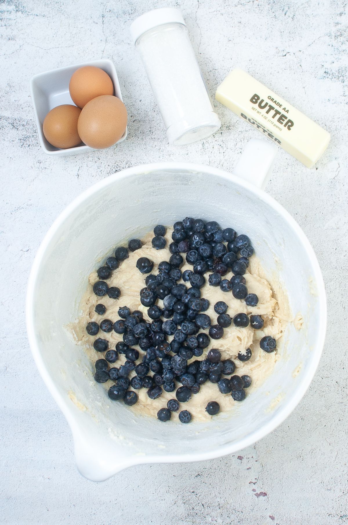 The blueberries are added to the batter.