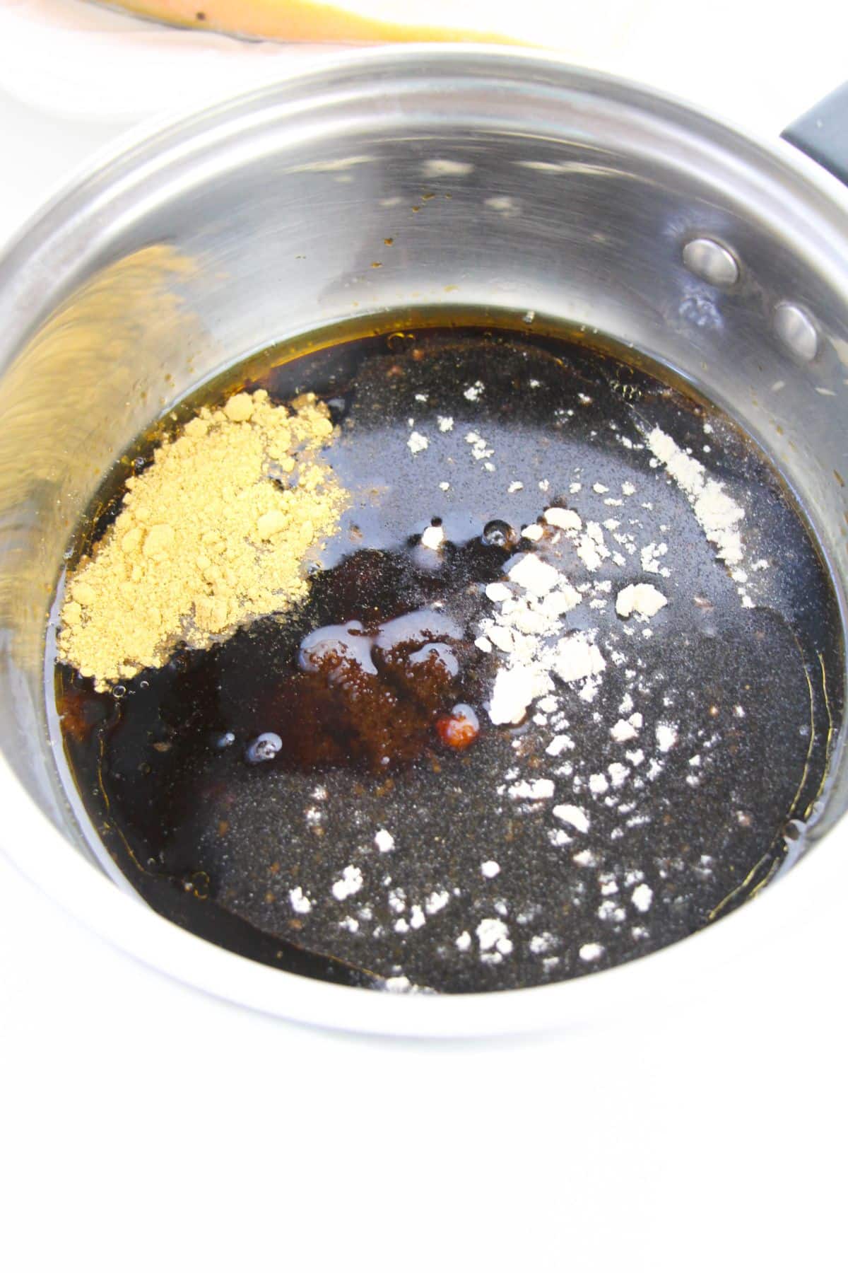 Soy sauce, brown sugar, ground ginger, garlic powder, honey, sesame oil and sherry in a small saucepan.