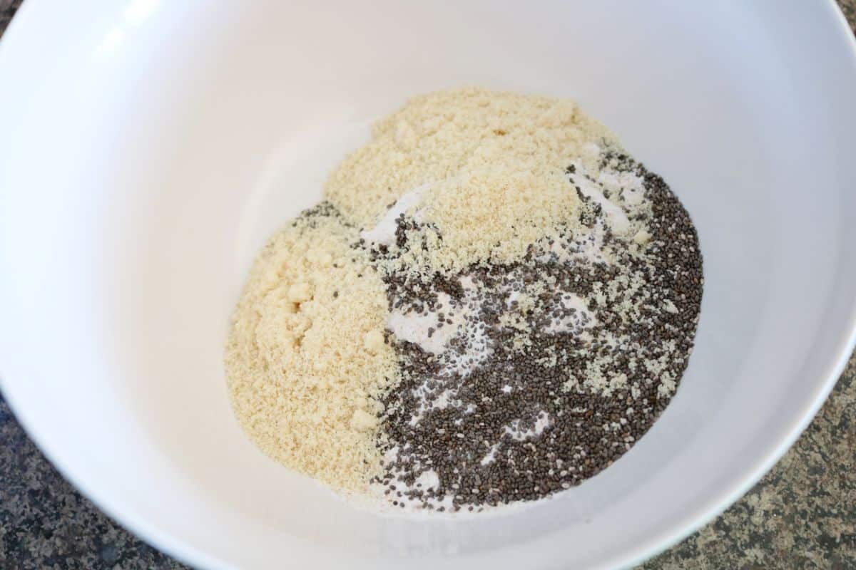 Flour, almond meal, baking powder and chia seeds in a large bowl.