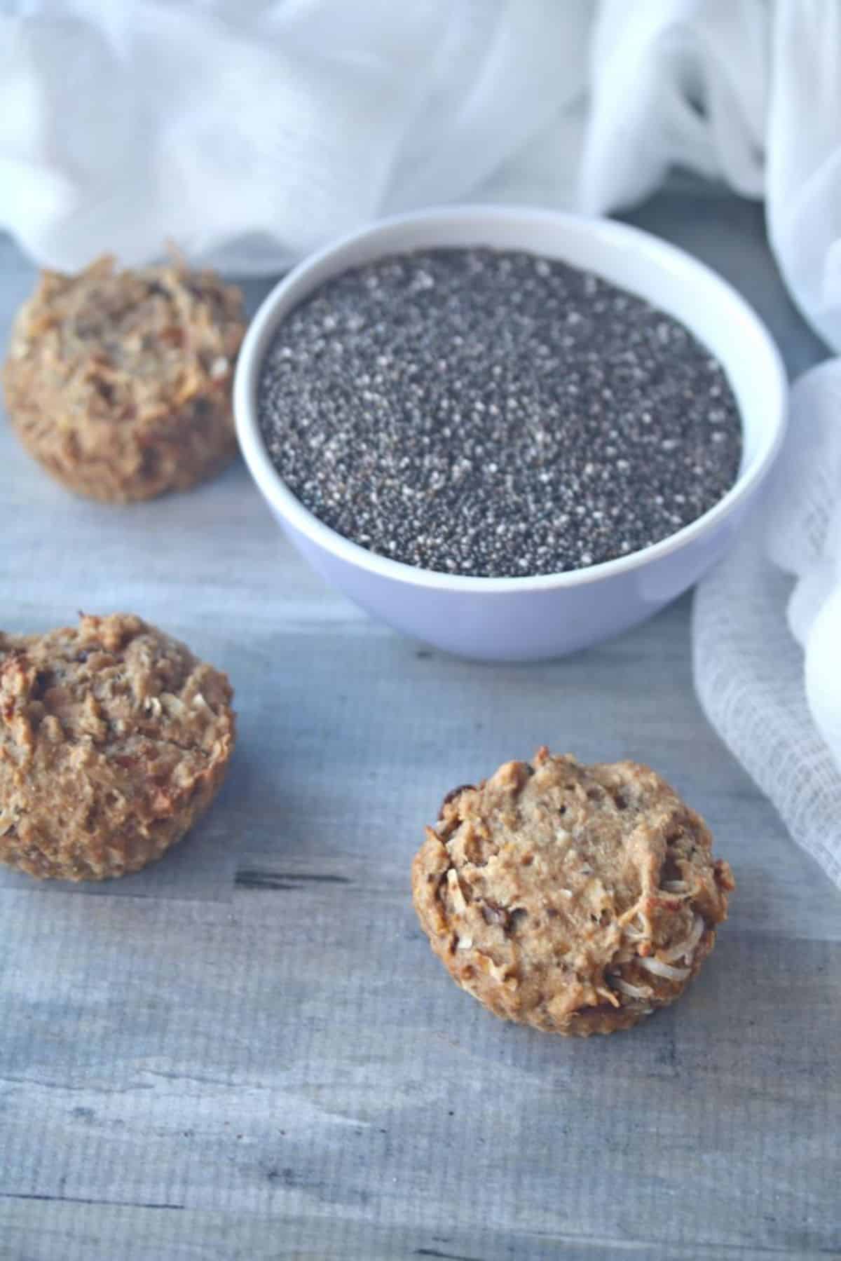 Healthy Breakfast Muffins with a bowl of chia seeds on the side.