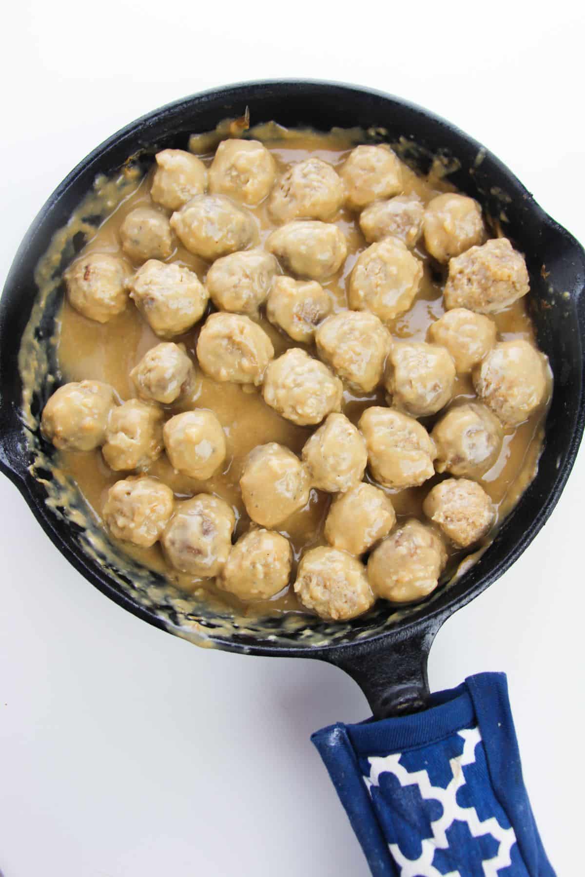 The meatballs are added to the gravy mixture.