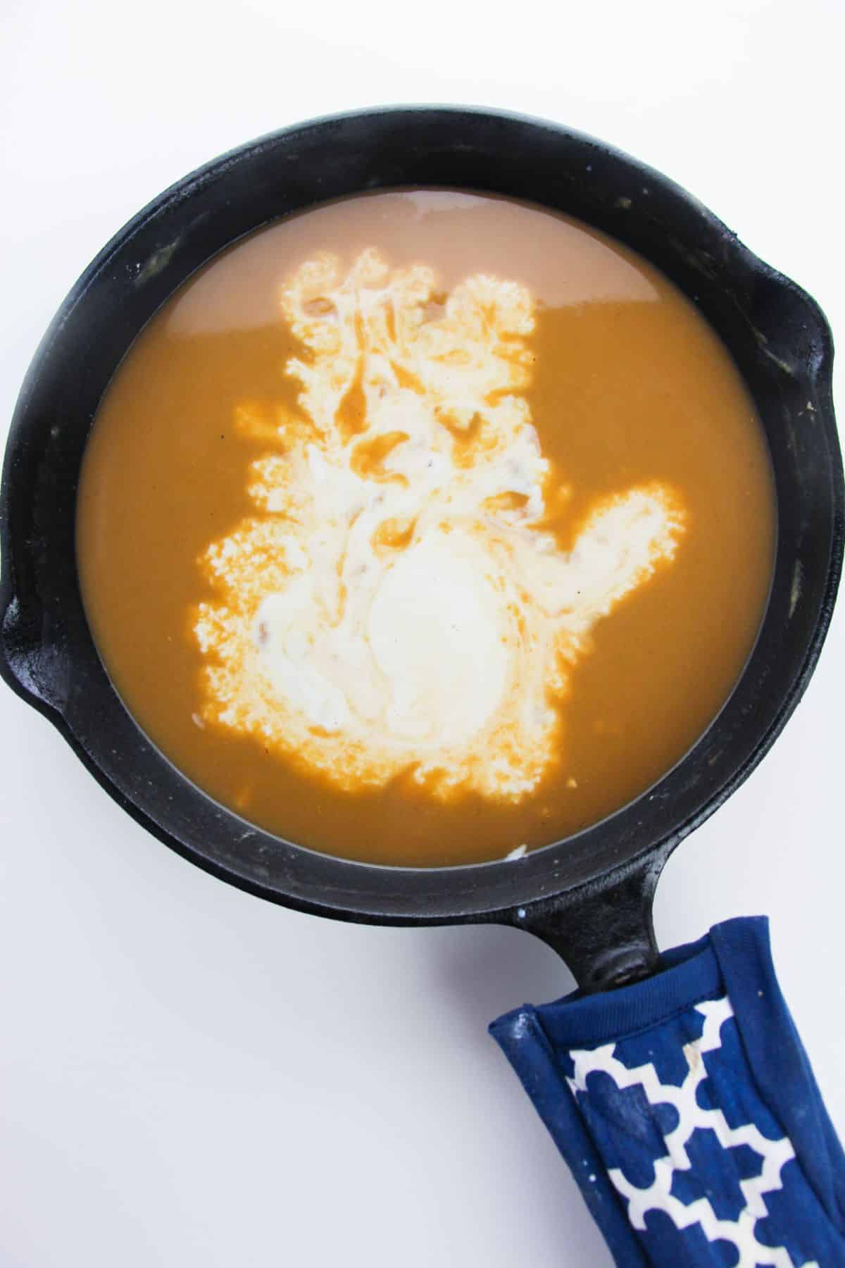 The milk is added to the gravy.