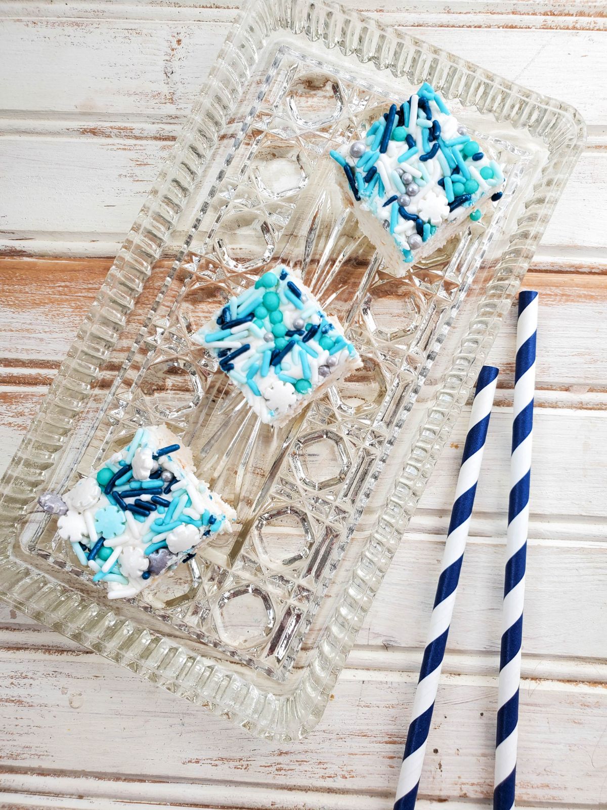 Sugar Cookie Fudge on a serving plate with party straws on the side. 