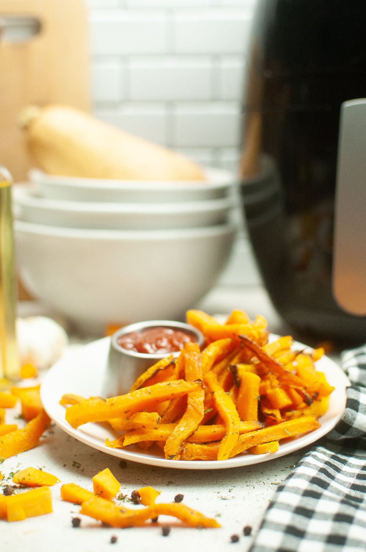 Air Fryer Butternut Squash Fries on a serving plate with dip on the side.