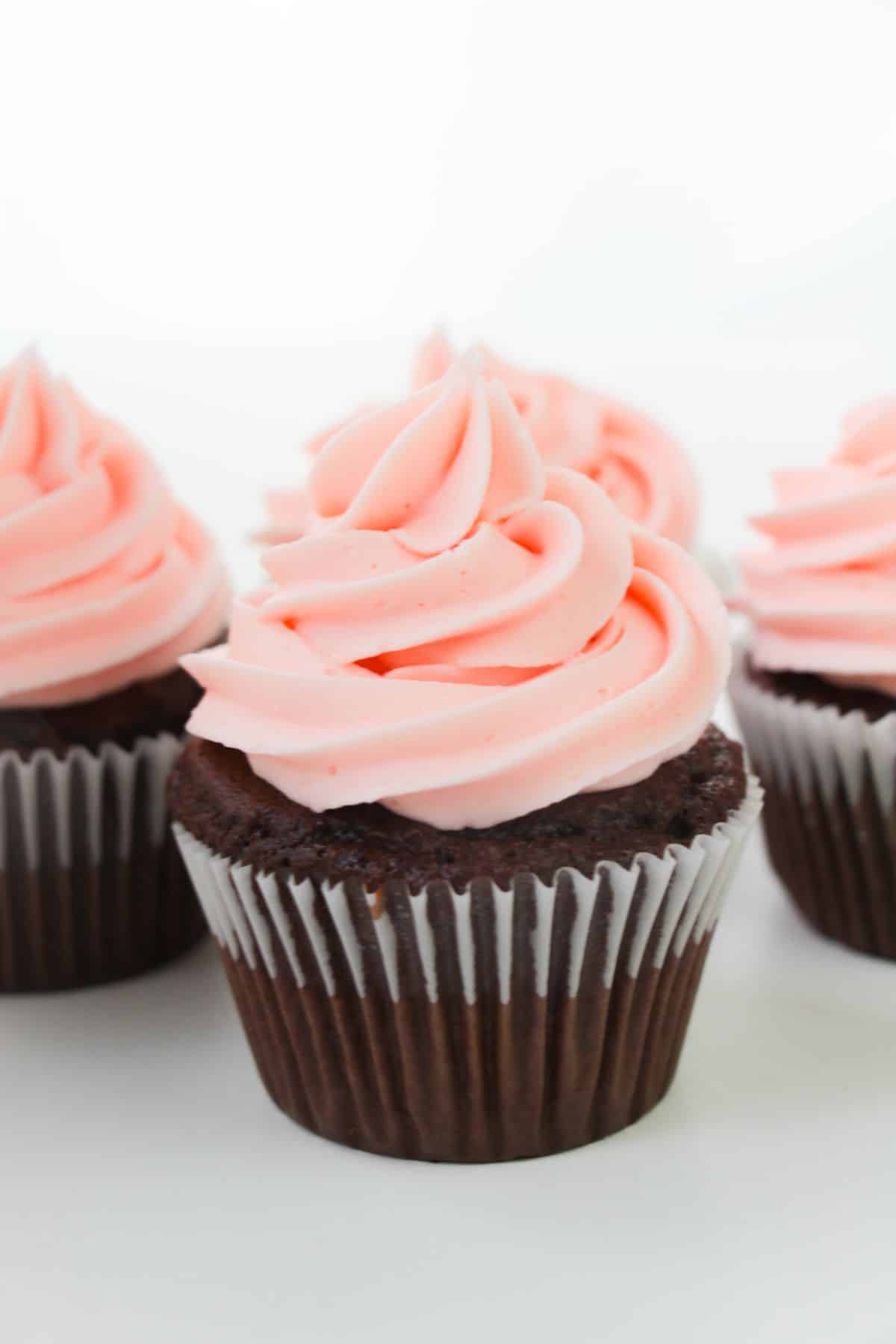 chocolate cupcakes with strawberry frosting.