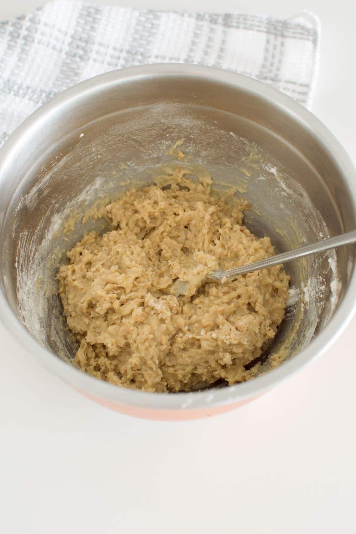 Wet and dry ingredients are combined together in a mixing bowl.
