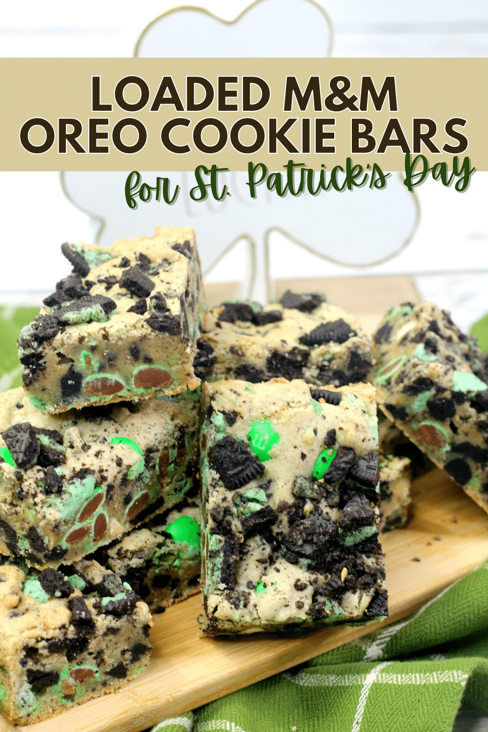 These Loaded M&M Oreo Cookie Bars for St. Patrick’s Day are soft, chewy and packed with sweet flavors. A perfect treat for the holiday! #loadedm&moreocookiebars #oreocookiebars #cookiebars #stpatricksday #holidaytreat via @wondermomwannab