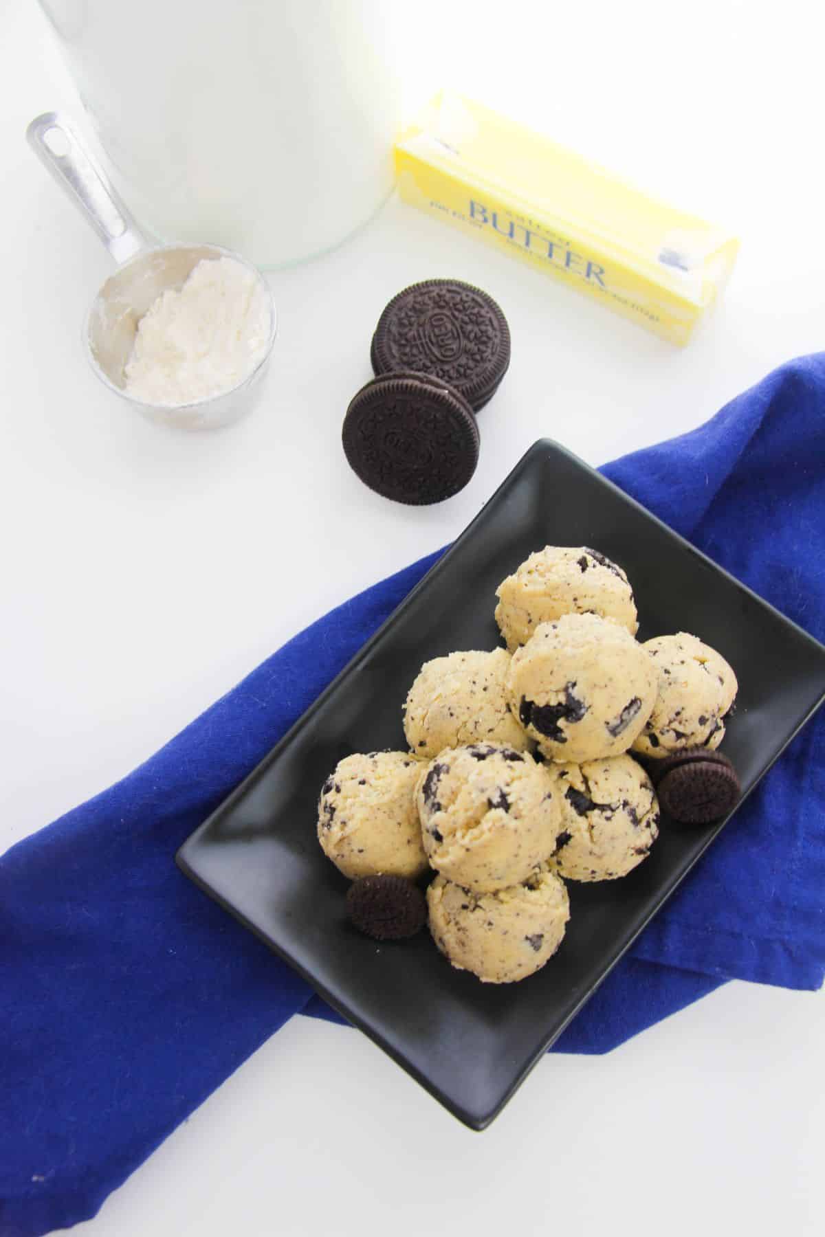 Oreos Cookie Dough on a serving plate, with ingredients on the side.