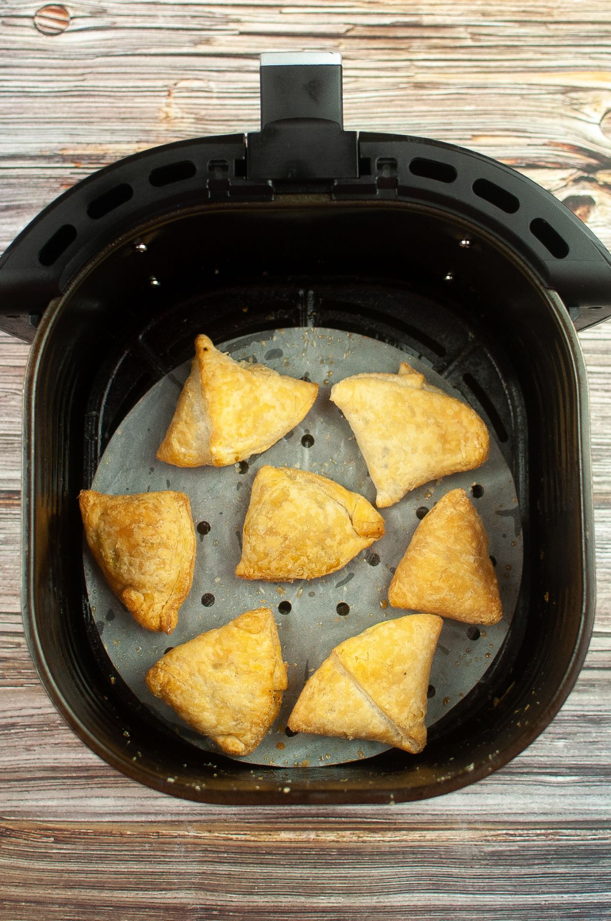 Cooked Samosas inside the Air Fryer.
