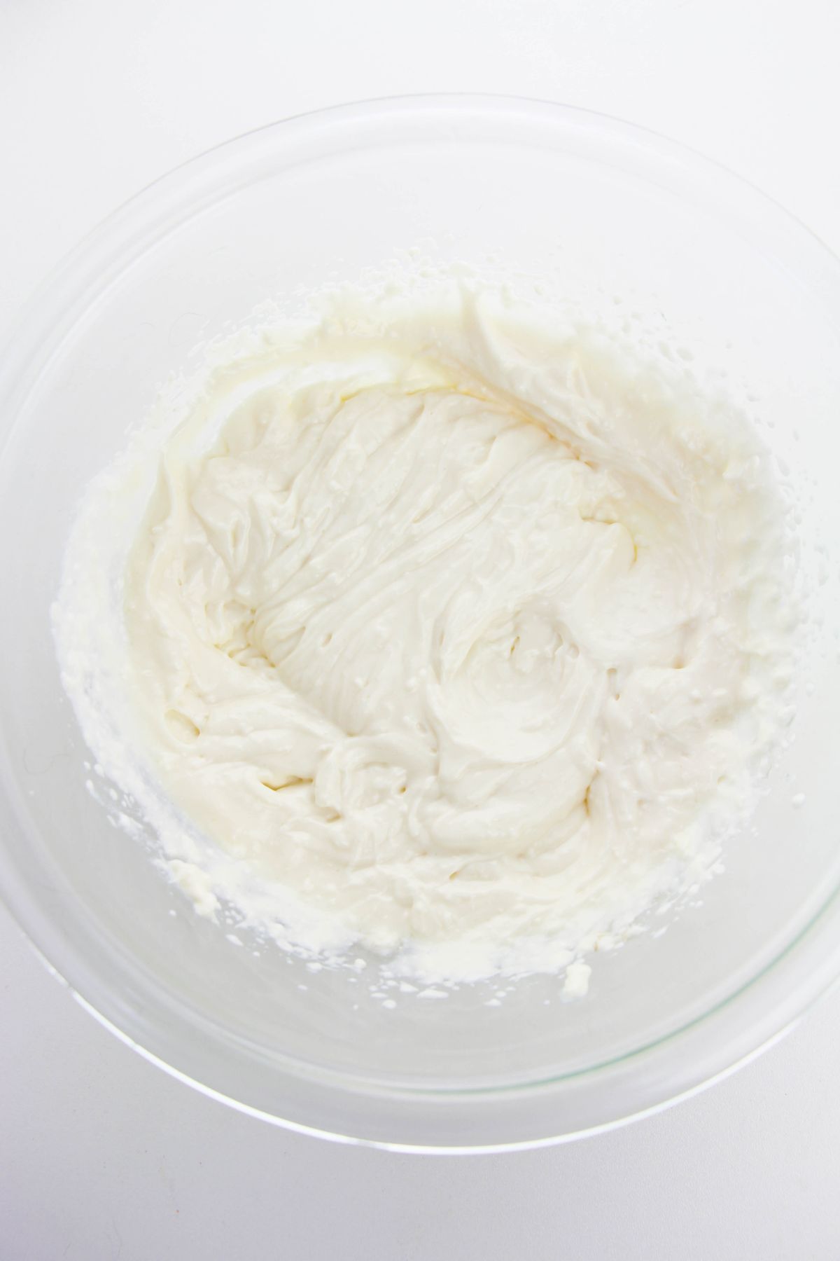 cream cheese, yogurt, white sugar, and vanilla extract in a large bowl.