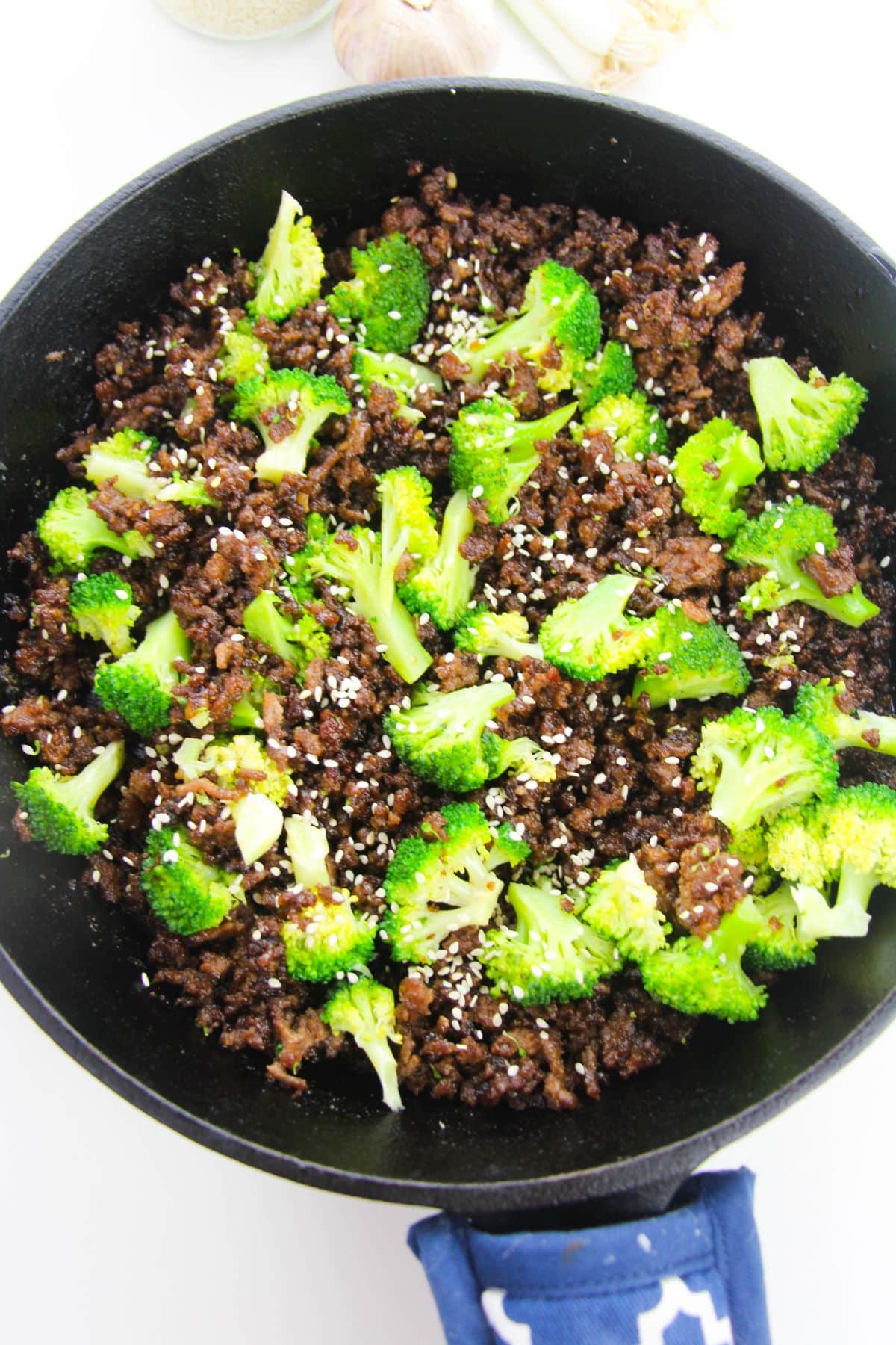 Broccoli and sesame seeds are added to the beef mixture.