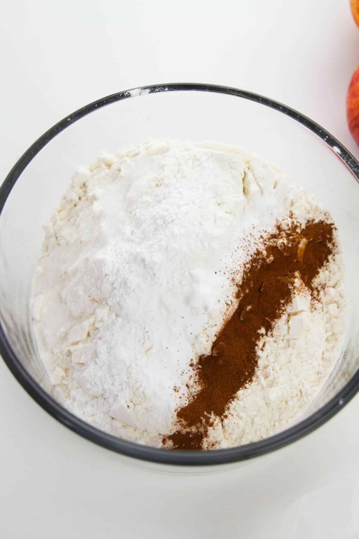 All-purpose flour, baking powder, salt,
baking soda and cinnamon in a mixing bowl.