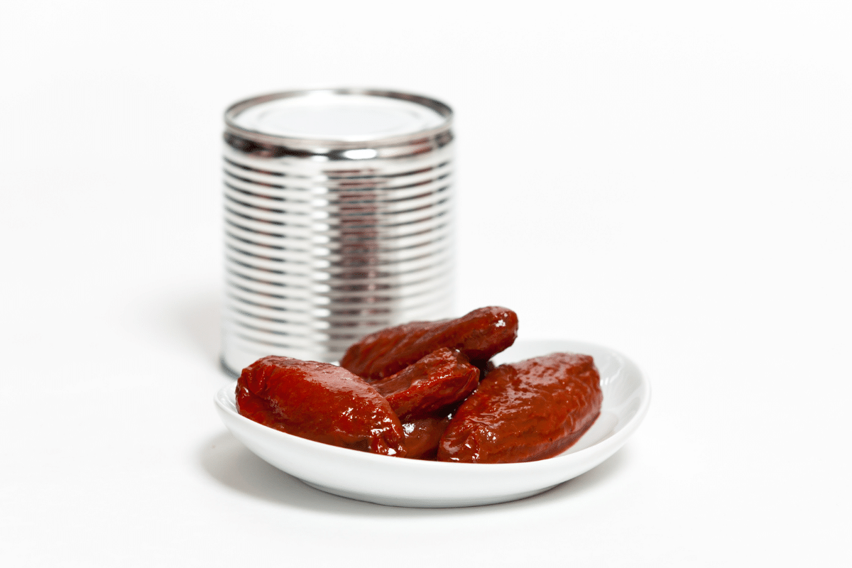 Chipotle Peppers on a small plate with can on the side.