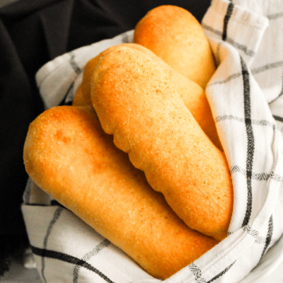Cheese Stuffed Breadsticks displayed on a checkered towel.