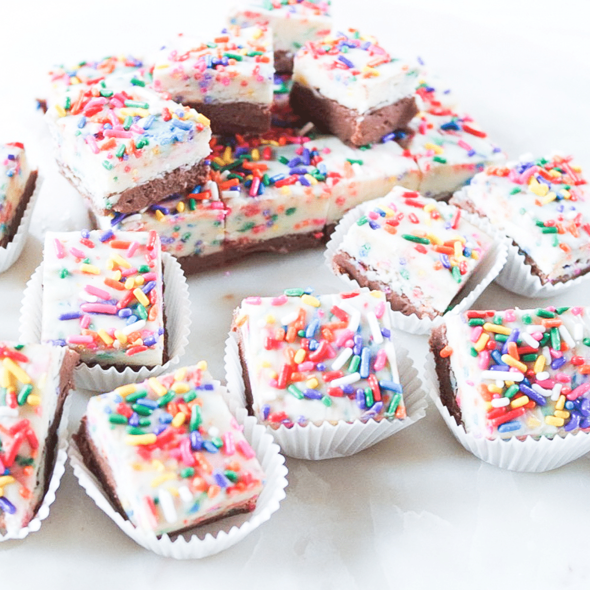 Funfetti fudge squares with sprinkles on top.