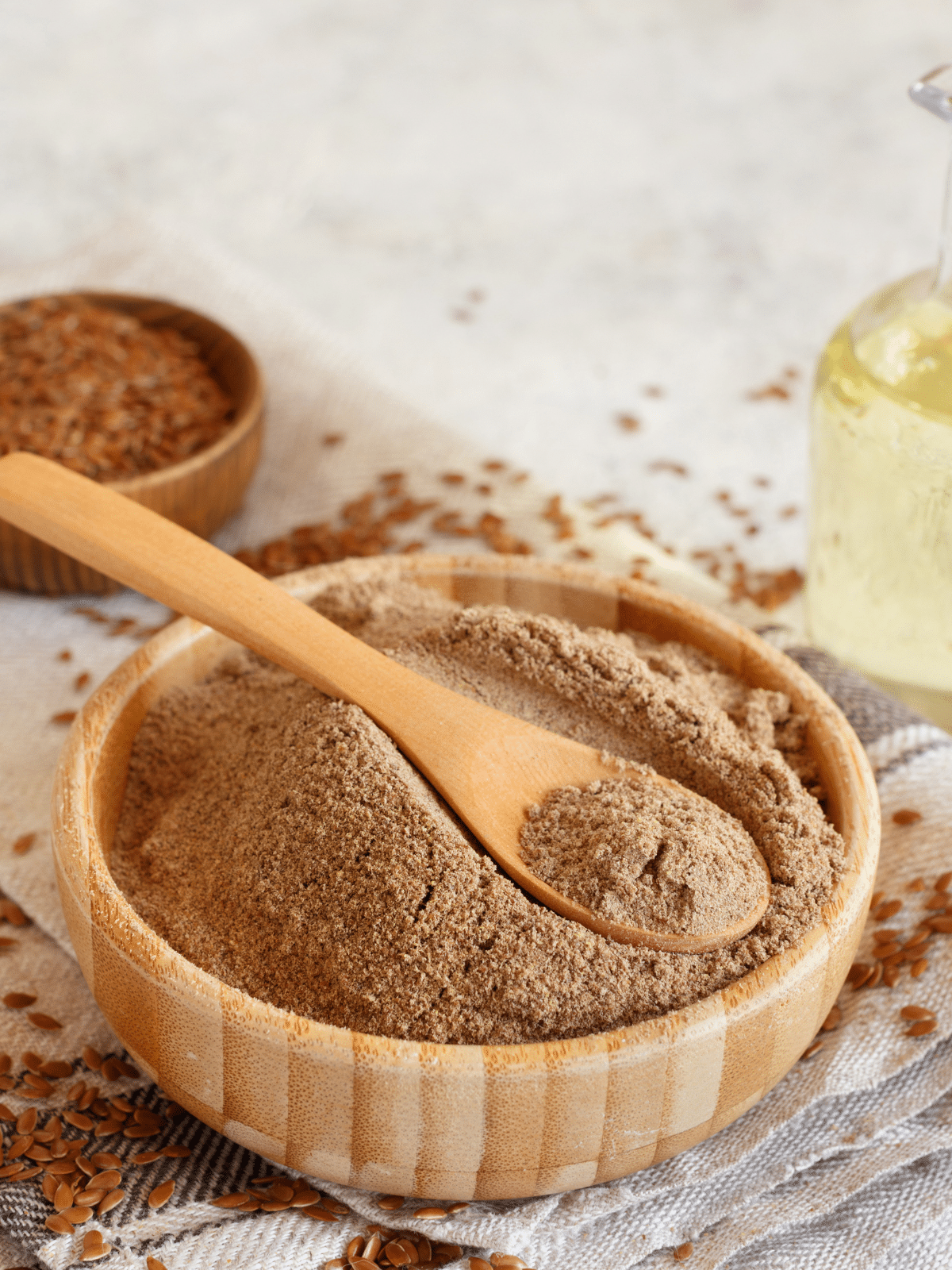 Flax meal flour in a wooden bowl.