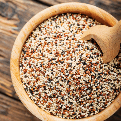 Substitute for quinoa displayed in a wooden bowl with a wooden spoon.