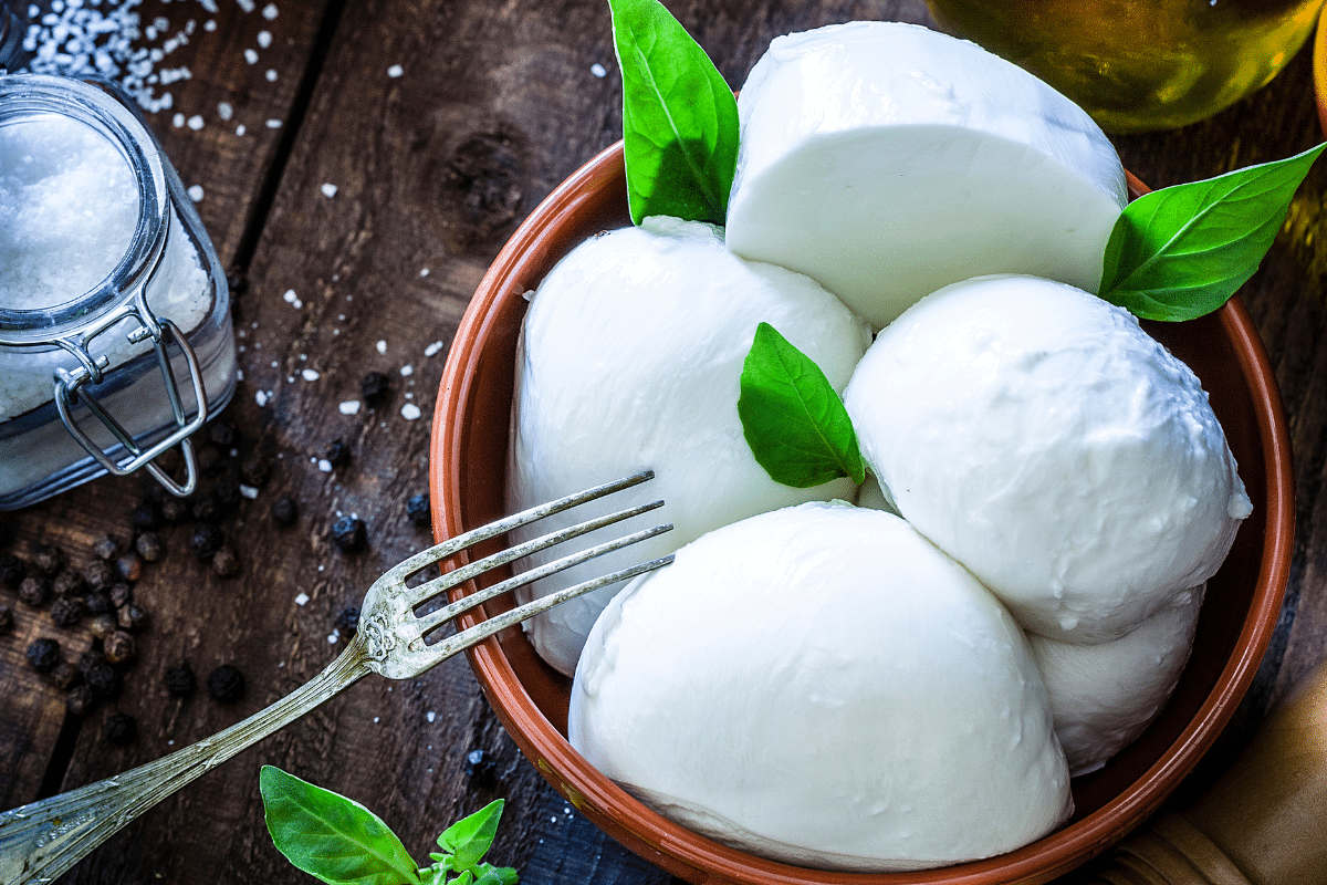 Substitute for burrata cheese with Mozzarella in a bowl.