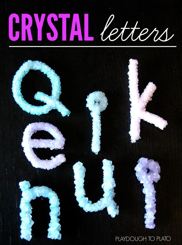 A set of crystal letters on a black background, perfect for engaging educational activities for kids.