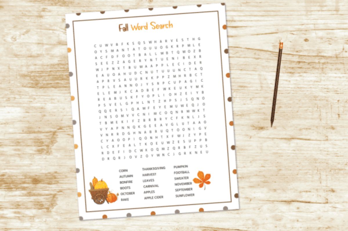 A fall-themed word search displayed on a wooden table.