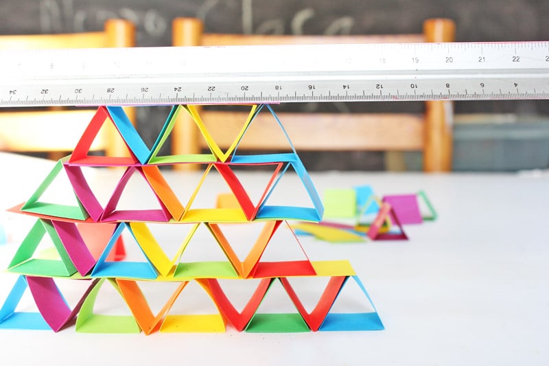 A stack of colorful origami triangles used for educational activities.