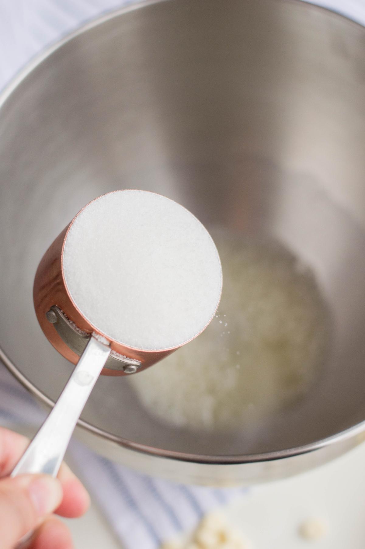 Granulated sugar is added to the egg mixture.