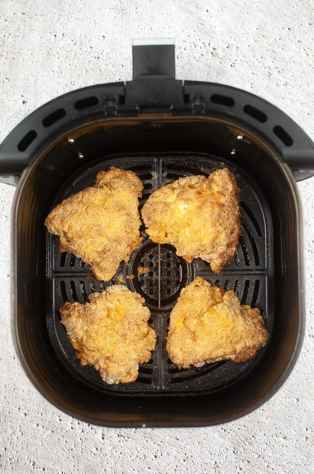 Cooked chicken breast inside the Air Fryer.