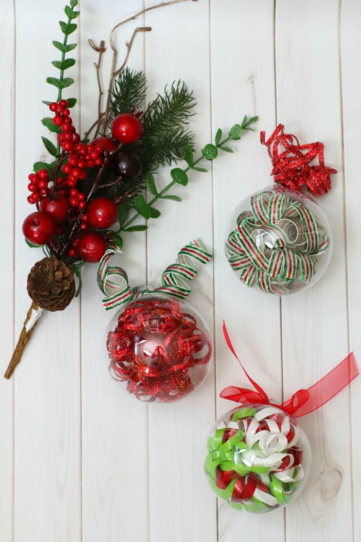 Christmas ornaments with ribbons and pine cones.