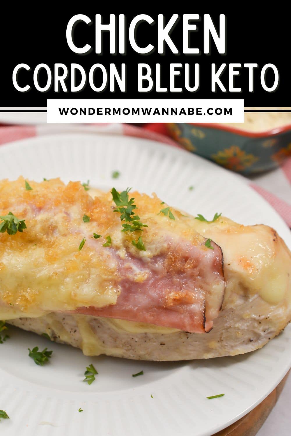 Chicken cordon bleu, a popular dish with crispy breaded chicken stuffed with gooey cheese and savory ham, transformed into a delicious keto-friendly meal served elegantly on a plate.