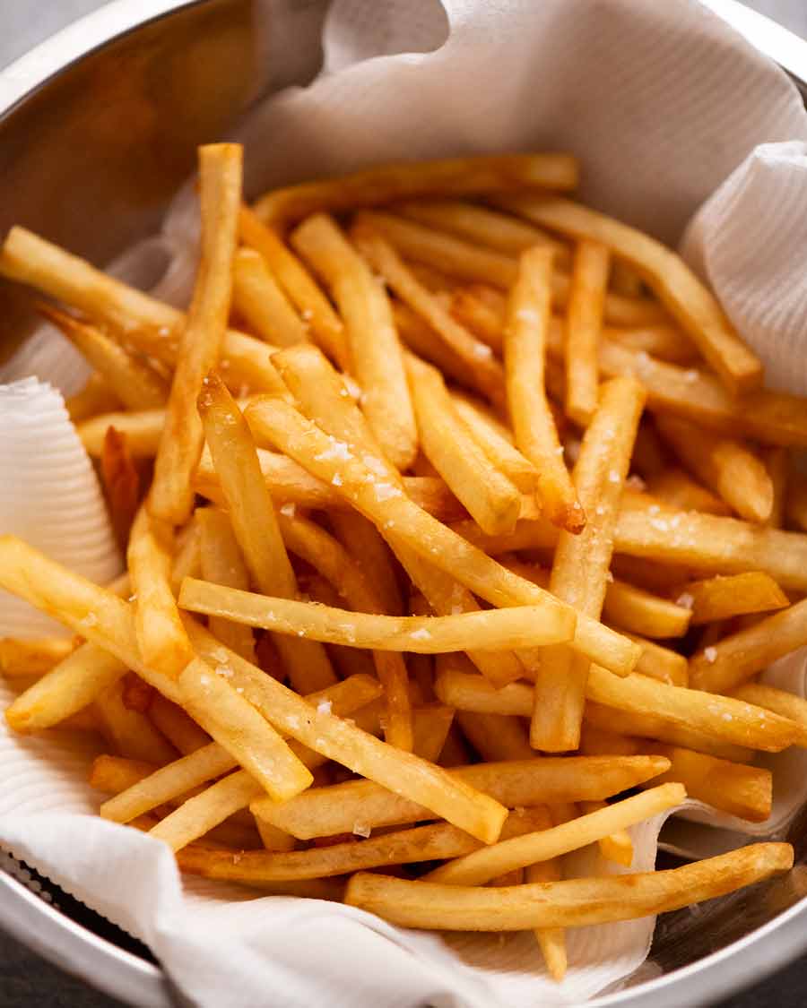 French fries in a bowl on a table.