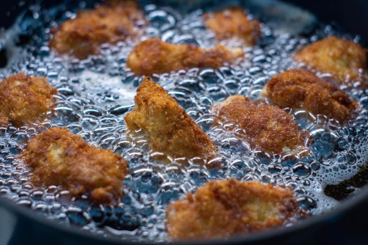 Southern-style fried chicken cooked in a frying pan.