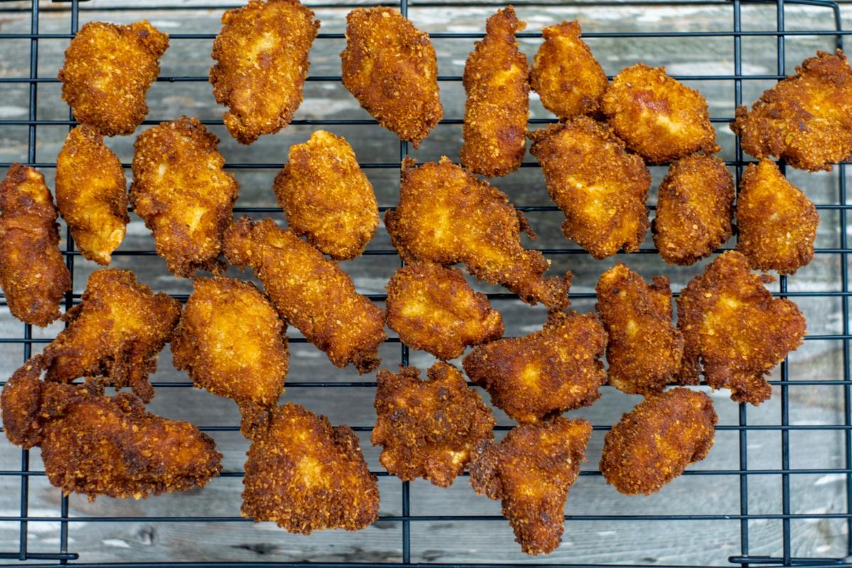 fried chicken on a cooling rack.