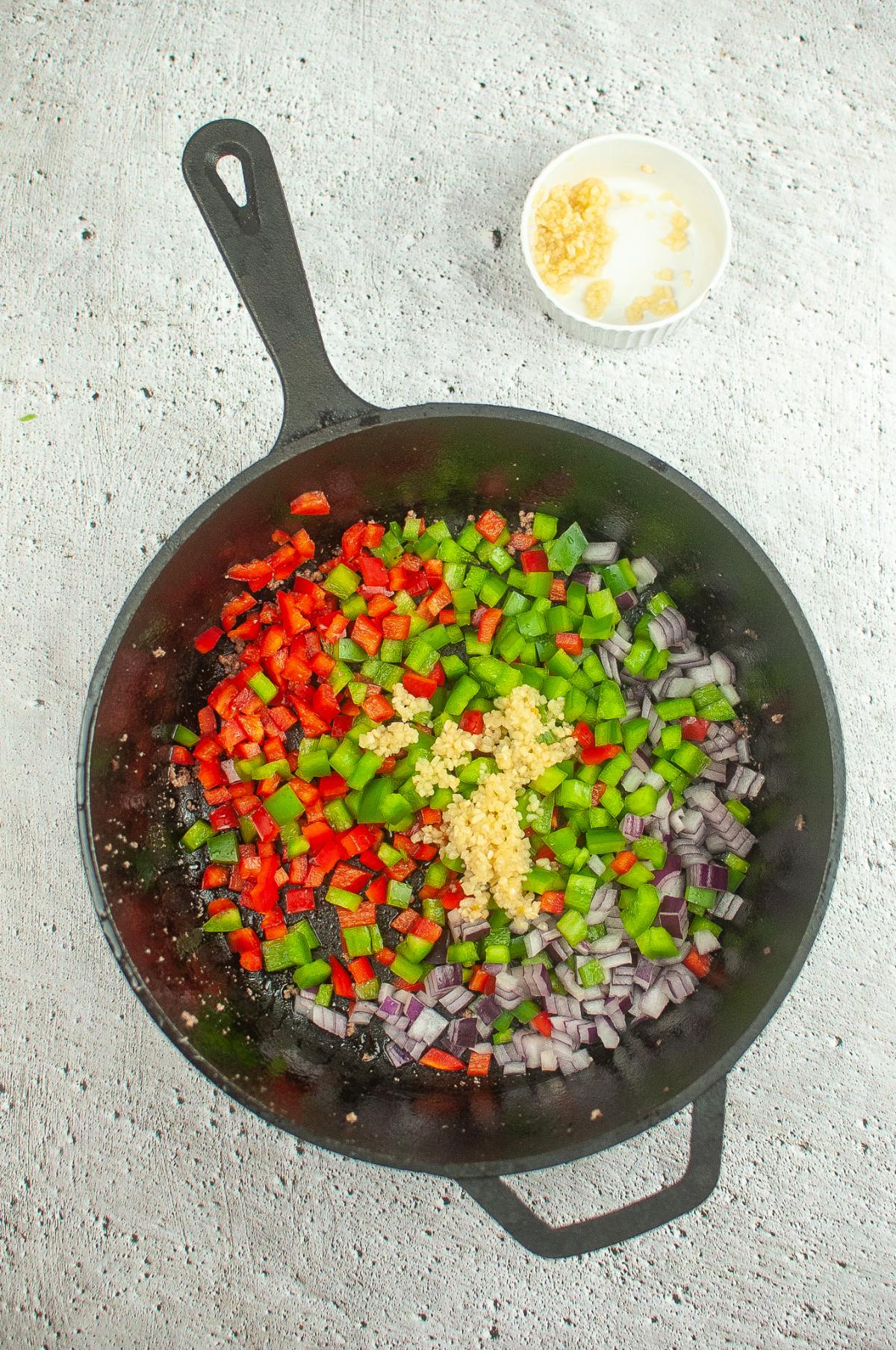 Vegetables cooking in a dutch oven.