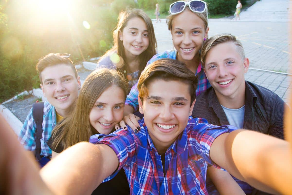 A group of teens snapping a selfie.