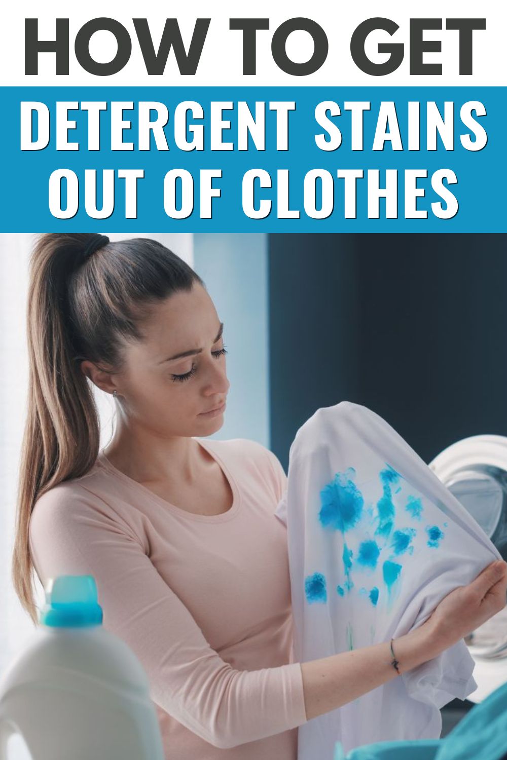 A woman holding a shirt with stains on it, wondering how to get rid of them.