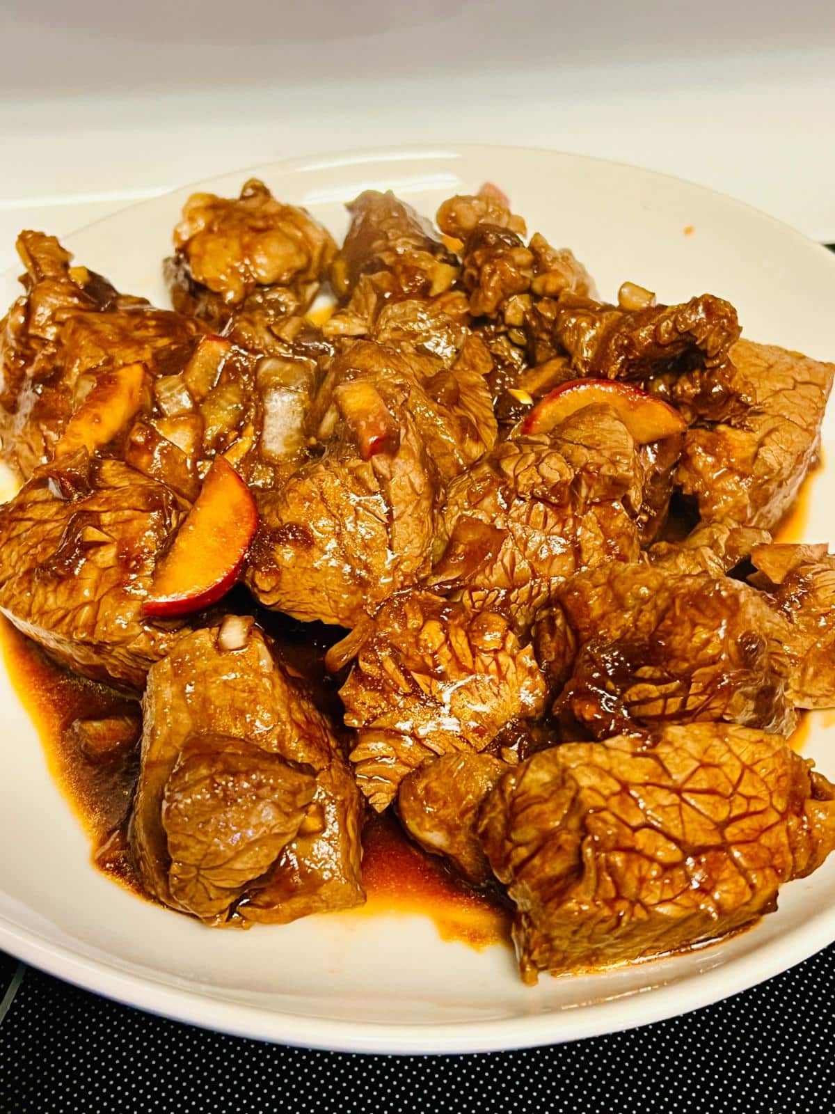 A plate of cooked marinated beef.