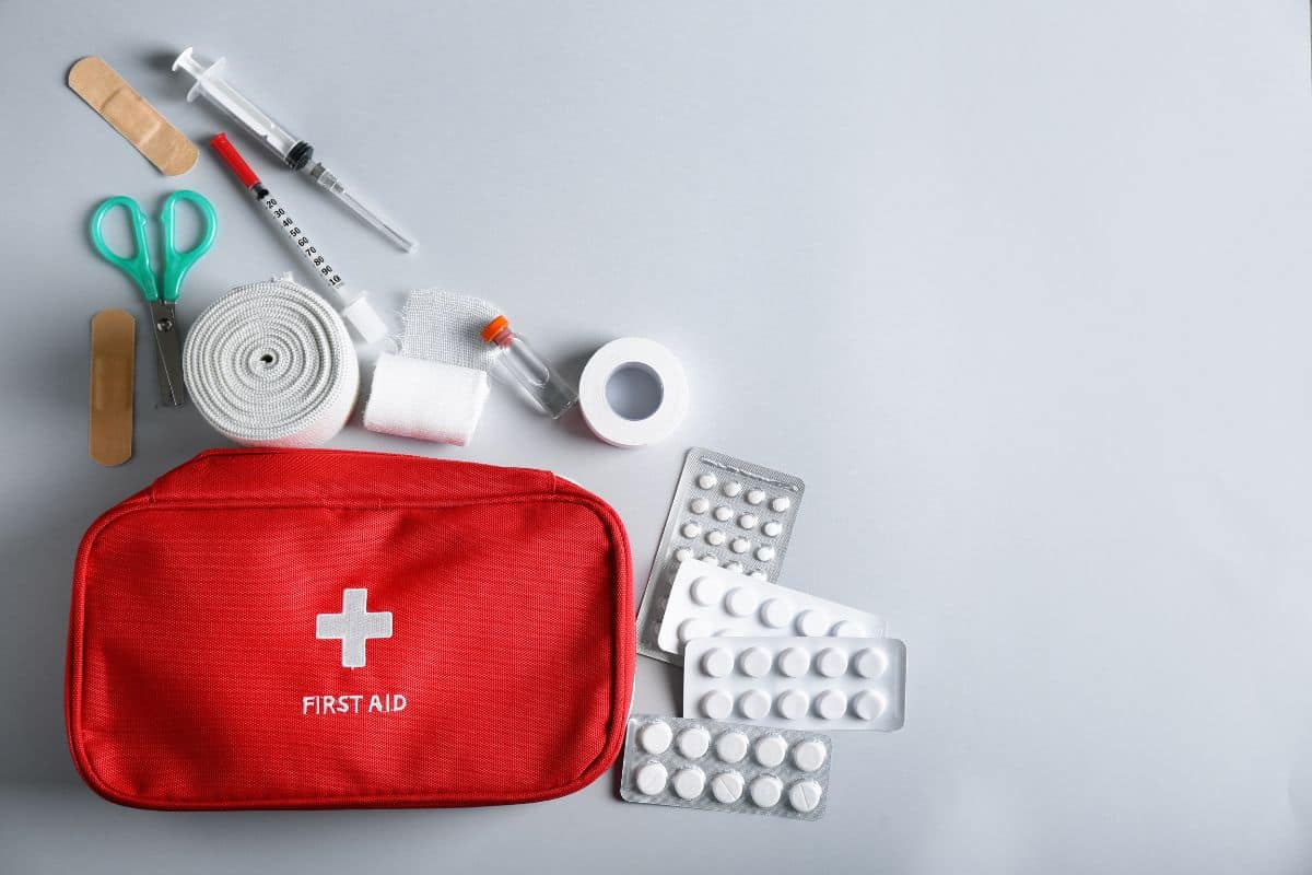 First aid kit on a gray background.