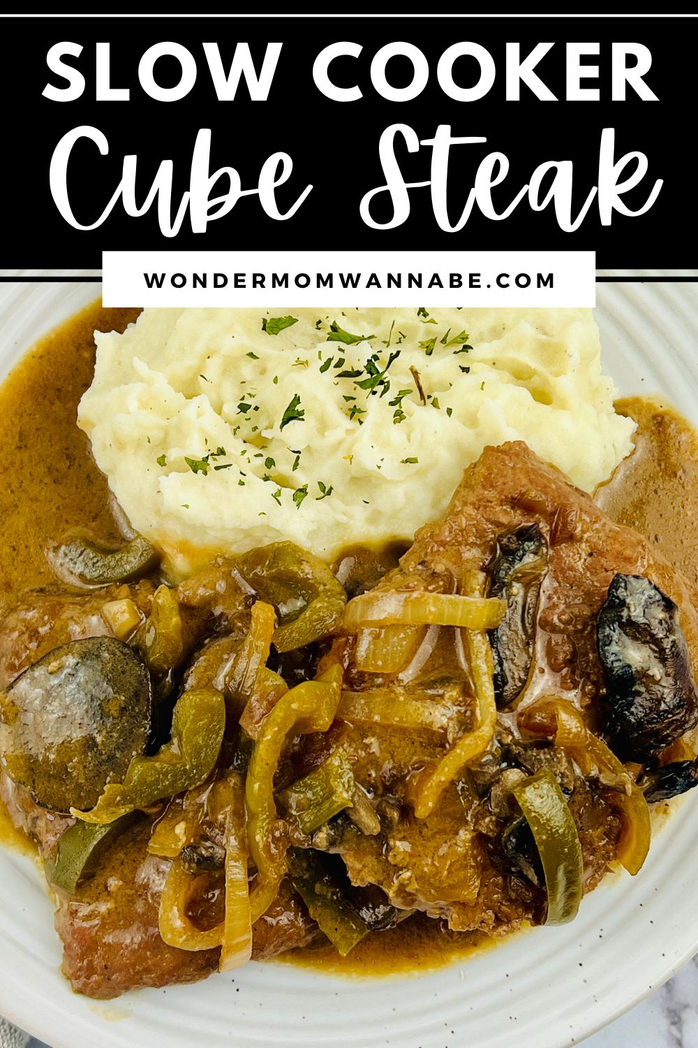 Slow cooker cube steak with mushrooms and mashed potatoes.