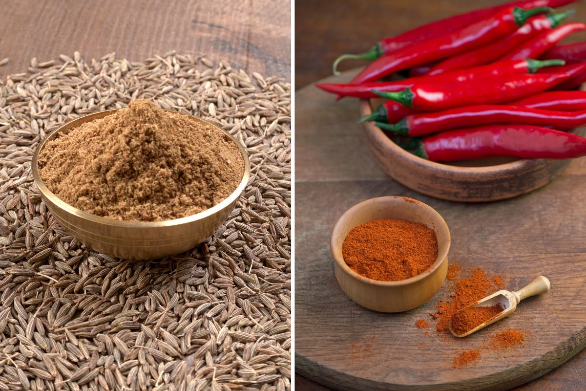 A bowl of ground cumin and chili powder on a wooden table, used as a substitute for curry powder.